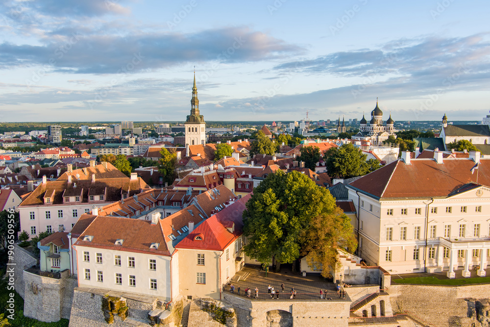 Fototapeta premium Iconic aerial skyline view of Tallinn Old Town and Toompea hill on a sunny summer evening. Stenbock House, Patkuli viewing platform, defensive walls, rooftops.
