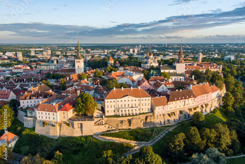 Iconic aerial skyline view of Tallinn Old Town and Toompea hill on a sunny summer evening. Stenbock House, Patkuli viewing platform, defensive walls, rooftops. photo