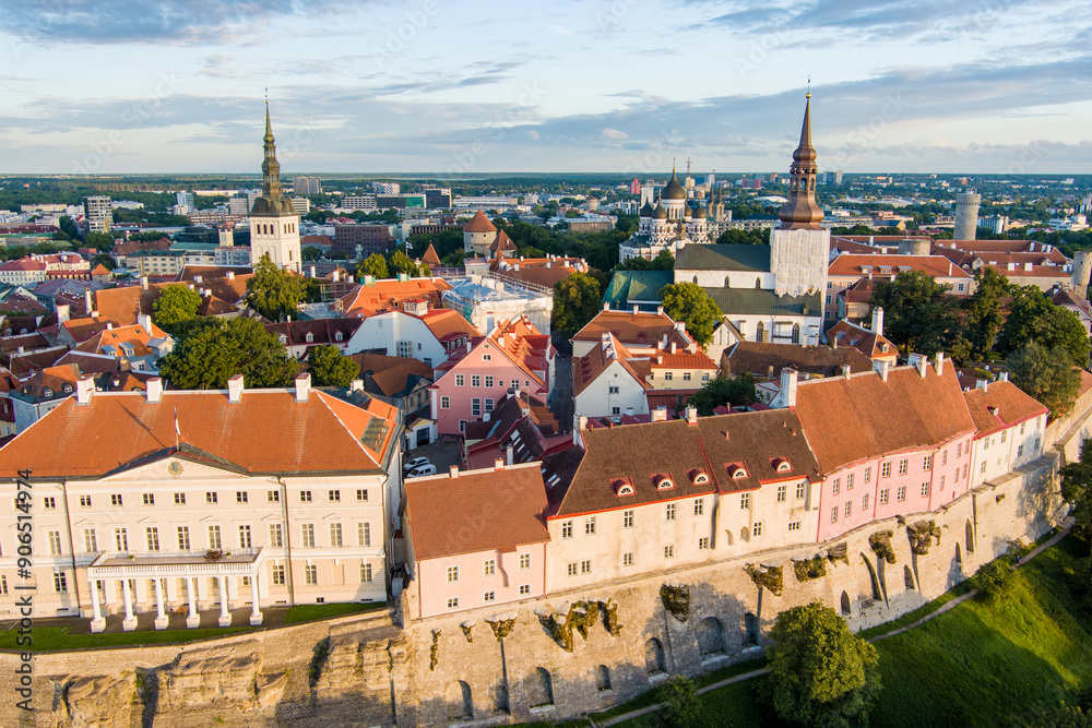 Fototapeta premium Iconic aerial skyline view of Tallinn Old Town and Toompea hill on a sunny summer evening. Stenbock House, Patkuli viewing platform, defensive walls, rooftops.