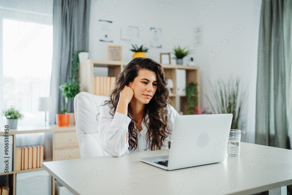 Young caucasian business woman working in office on laptop Young caucasian business woman working in office on laptop