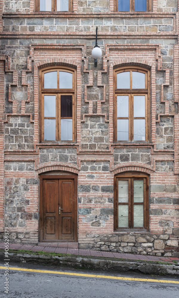 A well-preserved building features unique stonework and ornate windows, showcasing architectural beauty in a charming urban setting A well-preserved building features unique stonework and ornate windows, showcasing architectural beauty in a charming urban setting