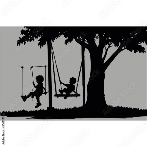 small children playing on swings