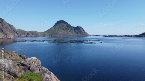 Aquaculture fish cartories on open sea seen from top view drone perspective in Northern Norway photo