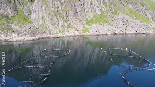 Aquaculture fish cartories on open sea seen from top view drone perspective in Northern Norway photo