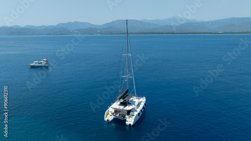 The beauty of a catamaran cruising, seen from above.