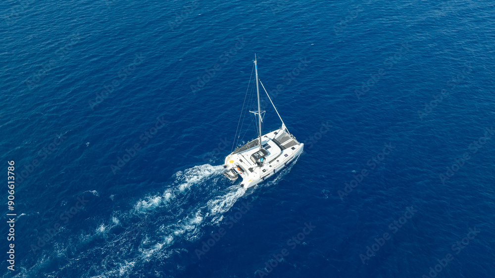 The beauty of a catamaran cruising, seen from above. The beauty of a catamaran cruising, seen from above.