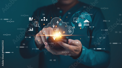 Businessman using cloud computing technology on a mobile device with virtual icons representing data management, innovation, and digital transformation.
