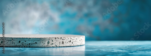 Elegant Podium Backdrop for Product Display Featuring Subtle Concrete Texture and Deep Blue Late Evening Sky photo