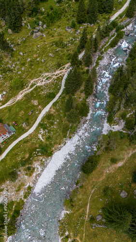 Aerial view of Val di Mello, a green valley surrounded by granite mountains and woods, renamed the Italian Yosemite Valley by nature lovers. Val Masino, Valtellina, Sondrio. Italy