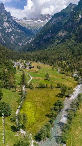 Aerial view of Val di Mello, a green valley surrounded by granite mountains and woods, renamed the Italian Yosemite Valley by nature lovers. Val Masino, Valtellina, Sondrio. Italy