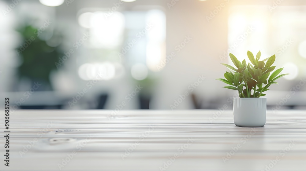 Fototapeta premium A vibrant indoor plant on a wooden table, adding a touch of nature and freshness to a modern workspace.