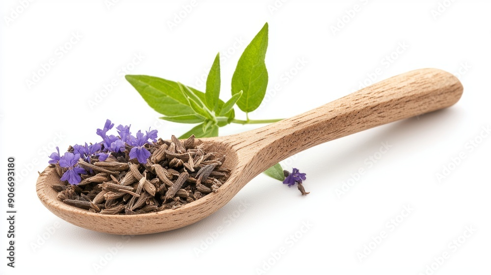 Fresh herbal leaves with delicate purple flowers displayed on a wooden spoon, perfect for culinary or wellness themes. Fresh herbal leaves with delicate purple flowers displayed on a wooden spoon, perfect for culinary or wellness themes.