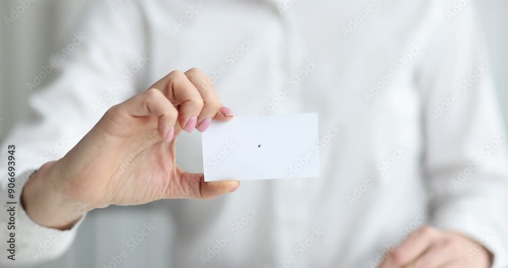 Businesswoman holds out white business card for dating. Business contacts concept Businesswoman holds out white business card for dating. Business contacts concept