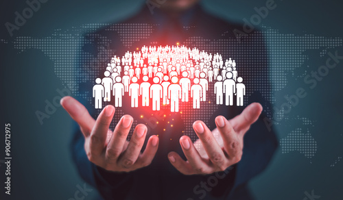 Population decline crisis concept. Increase birth rate, fertility rate and population decrease control. Businessman hold population family icon with world map background. Demography statistics.