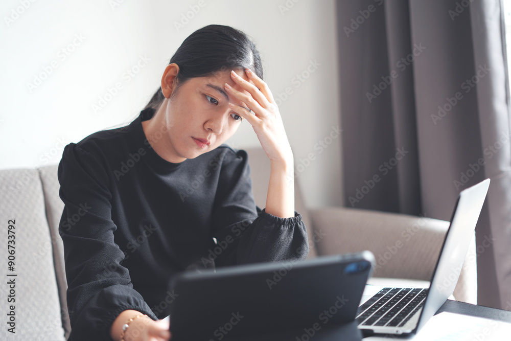 Stressed young asian woman suffering the neck pain and head ache while working with electronic device the whole day without resting, massaging and rubbing, and it is a kind of office syndrome concept Stressed young asian woman suffering the neck pain and head ache while working with electronic device the whole day without resting, massaging and rubbing, and it is a kind of office syndrome concept