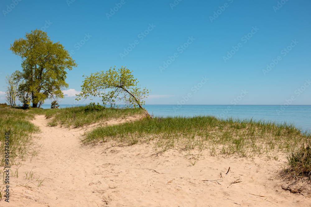 A trail over the sand dunes along Lake Michigan shoreline at Point Beach State Park, Two Rivers, Wisconsin in early June A trail over the sand dunes along Lake Michigan shoreline at Point Beach State Park, Two Rivers, Wisconsin in early June