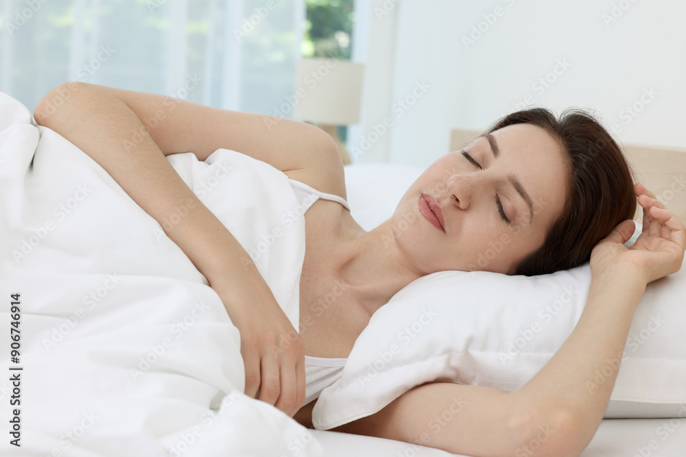 Bedtime. Woman sleeping in bed at home