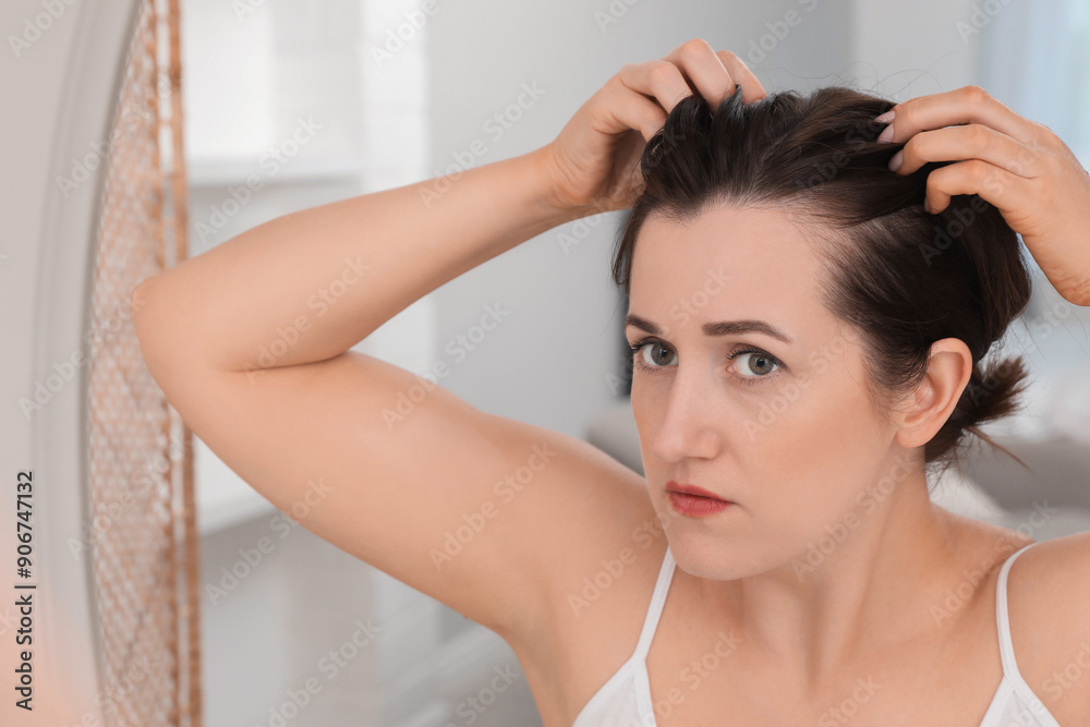 Woman with hair loss problem at home Woman with hair loss problem at home