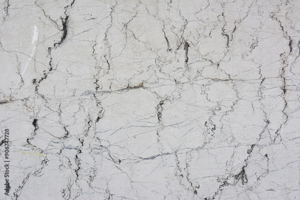 Fototapeta premium Concrete rough wall surface with cracks
