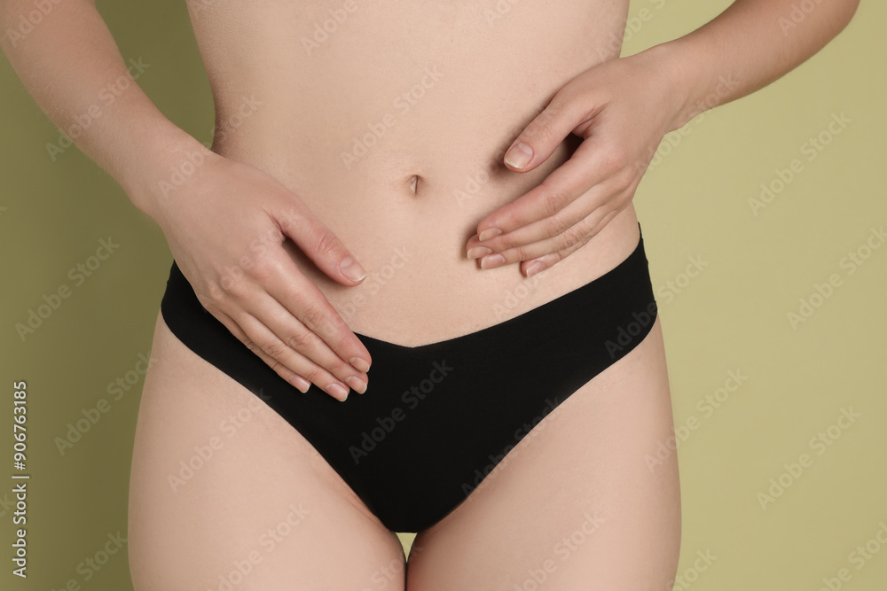 Woman with slim body posing on olive background, closeup Woman with slim body posing on olive background, closeup