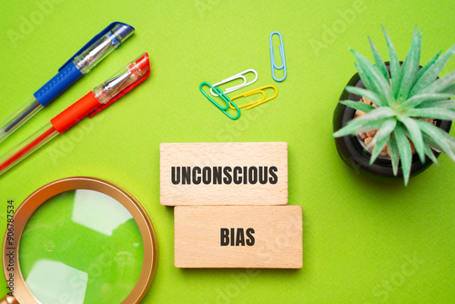 Unconscious bias concept - attitudes or stereotypes that affect our understanding, actions, and decisions in an unconscious manner. Implicit bias. Social norms or cultural influences. Wooden blocks photo