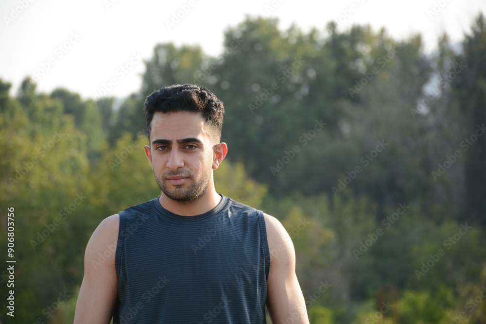 an athletic man looking forward and standing an athletic man looking forward and standing