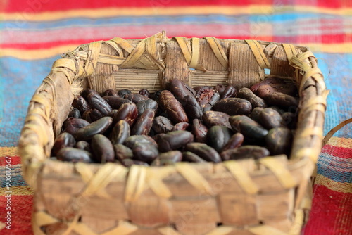 Punnet upon a table in a farm on the Ruta del Cacao Route sociocultural trail holding fermented, dry, roasted nibs of cocoa beans. Baracoa-Cuba-565 photo