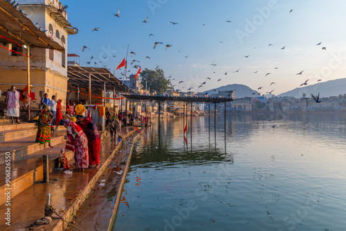 Pilgrims at Pushkar Lake at sunrise, Pushkar, Rajasthan, India, South Asia, Asia photo