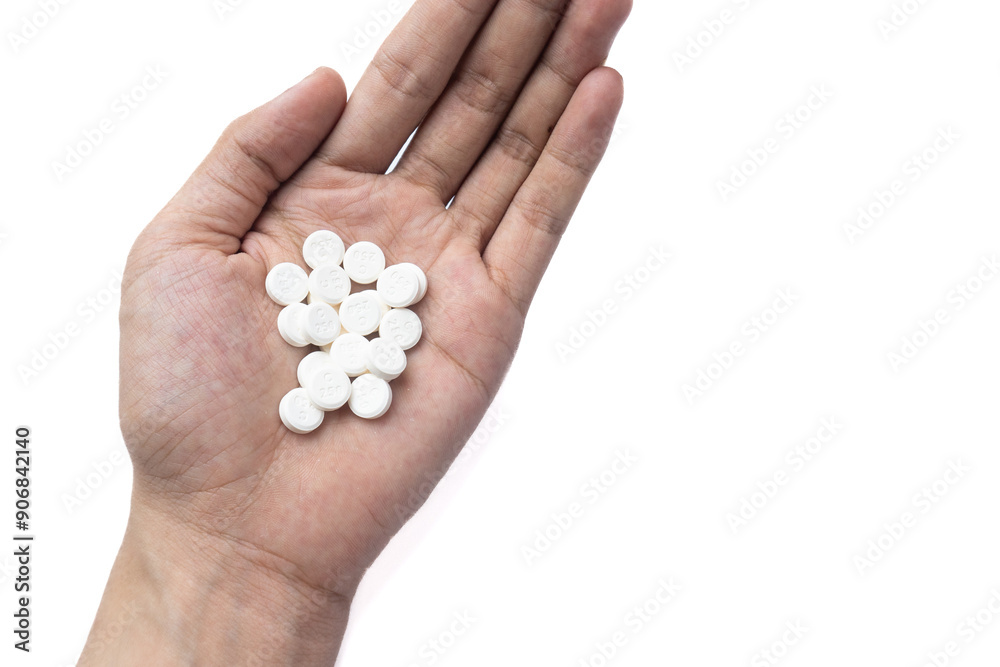 White pills in hand on white background White pills in hand on white background