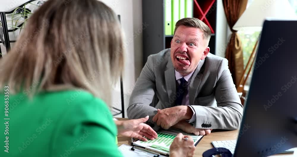 Businessman fooling around and making faces while talking to colleague 4k movie slow motion. Jokes at work concept
