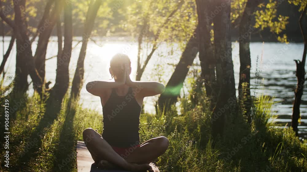Woman is practicing yoga in nature. Seated gentle easy pose for relief. Woman is practicing yoga in nature. Seated gentle easy pose for relief.