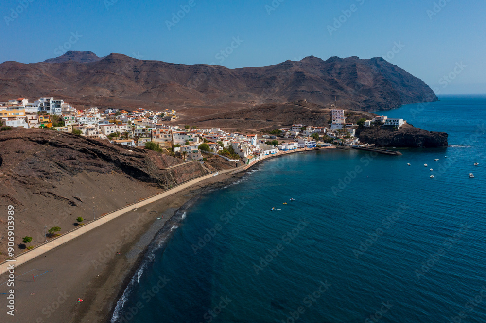 A breathtaking view of the town Las Playitas nestled between rugged mountains and the azure Atlantic. This stunning Fuerteventura landscape captures the essence of the Canary Islands' unique beauty. A breathtaking view of the town Las Playitas nestled between rugged mountains and the azure Atlantic. This stunning Fuerteventura landscape captures the essence of the Canary Islands' unique beauty.