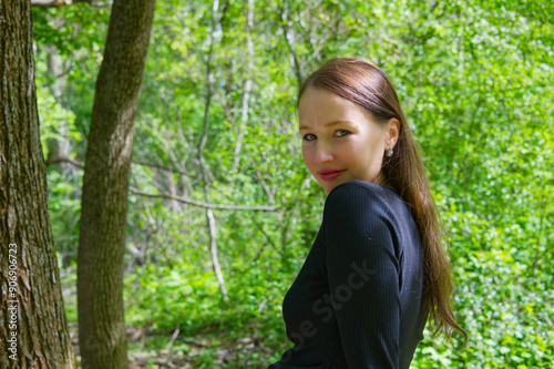 Portrait of a young adult woman in the park