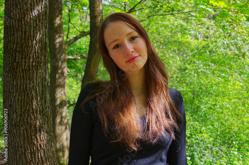 Portrait of a young adult woman in the park