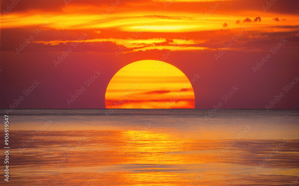 Vibrant Sunset Over Calm Ocean Waters With Warm Colors and Clouds at Dusk Vibrant Sunset Over Calm Ocean Waters With Warm Colors and Clouds at Dusk