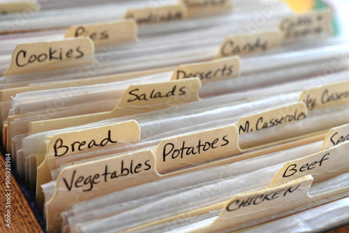 Handwritten recipe divider categories on cards filed in a recipebox box