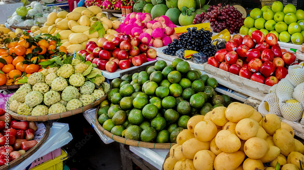 A vibrant display of tropical fruits at an Asian market, perfectly capturing the abundance and diversity of summer produce A vibrant display of tropical fruits at an Asian market, perfectly capturing the abundance and diversity of summer produce