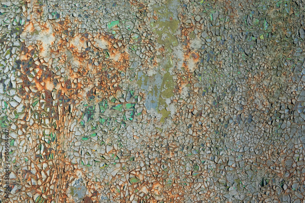 Close-up of old rusty iron sheet with cracked and destroyed paint of blue and green colors. Background. Texture Close-up of old rusty iron sheet with cracked and destroyed paint of blue and green colors. Background. Texture
