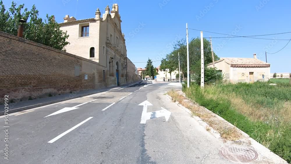 a paved road passing through Cartuja Baja, neighborhood of Zaragoza, Aragon, Spain a paved road passing through Cartuja Baja, neighborhood of Zaragoza, Aragon, Spain