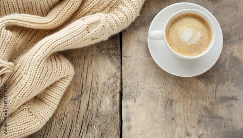 Warm Coffee and Knitted Sweater on Wooden Table - Perfect Cozy Autumn or Winter Morning
