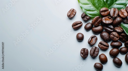 Fresh Coffee Beans And Green Leaves Arranged On A Light Gray Surface