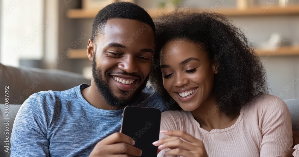 Smiling Couple Looking at Phone Together Smiling Couple Looking at Phone Together