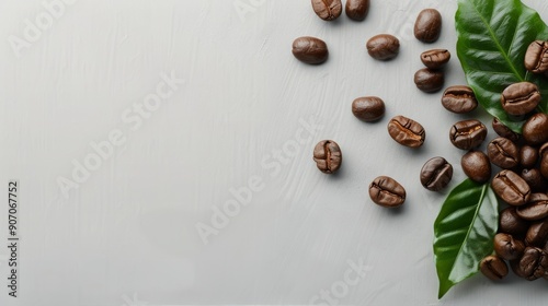 Fresh Coffee Beans And Green Leaves Arranged On A Light Gray Surface