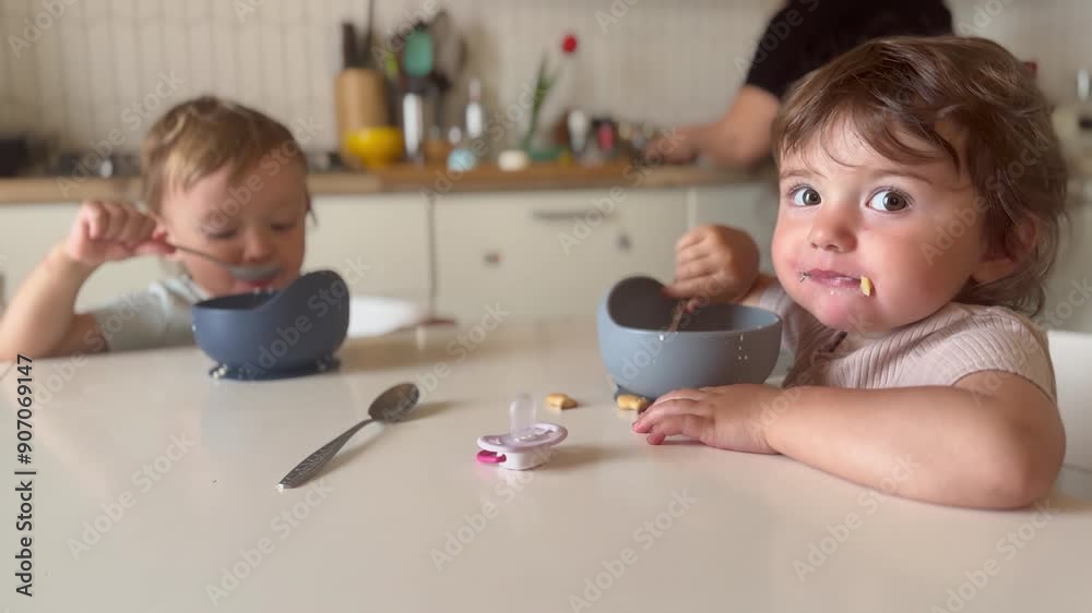 children eat breakfast. happy family kid dream concept. children in a family sit at the table and eat. little toddlers boy and girl eating food early lifestyle in the morning