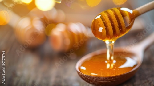 Natural Honey Dripping From Wooden Spoon Against a Soft, Blurred Background