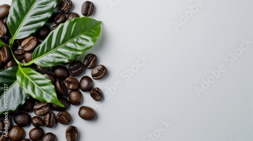 Fresh Coffee Beans And Green Leaves Arranged On A Light Gray Surface