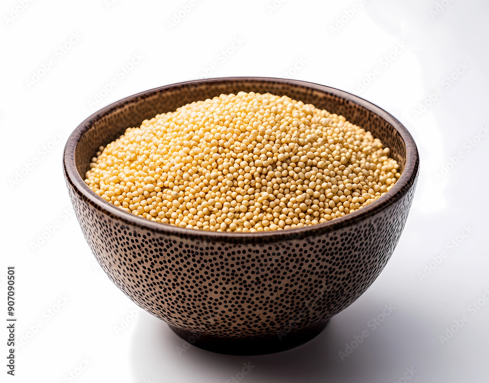 Bowl of millet on a white background with a detailed photo of a bowl full of golden colored quinoa grain Bowl of millet on a white background with a detailed photo of a bowl full of golden colored quinoa grain