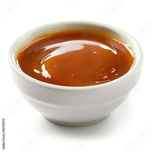 White bowl filled with caramel sauce