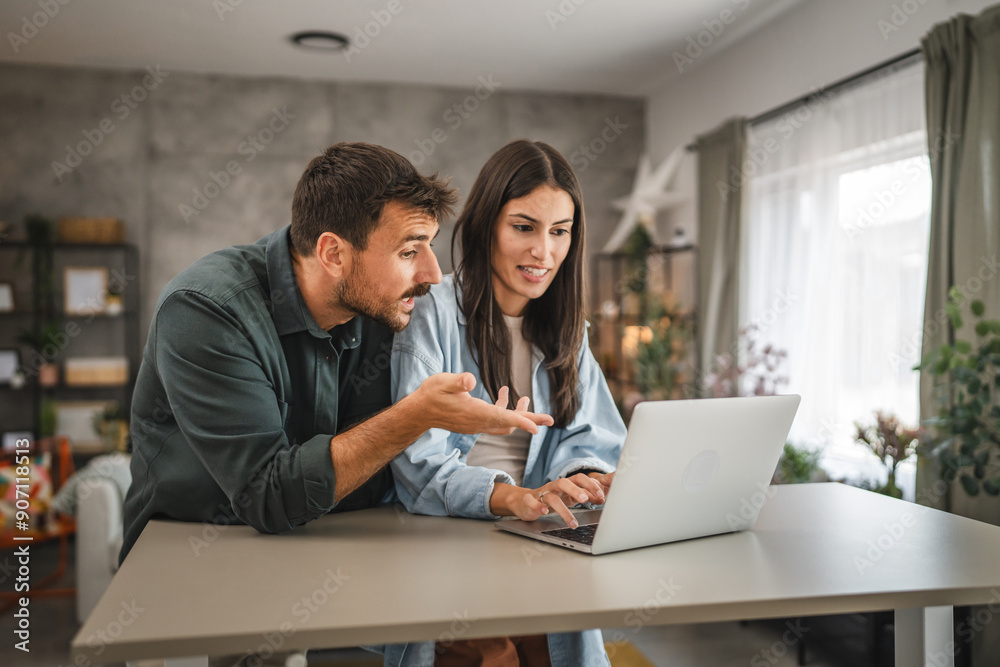 adult caucasian couple stand and use, study learn on laptop at home adult caucasian couple stand and use, study learn on laptop at home