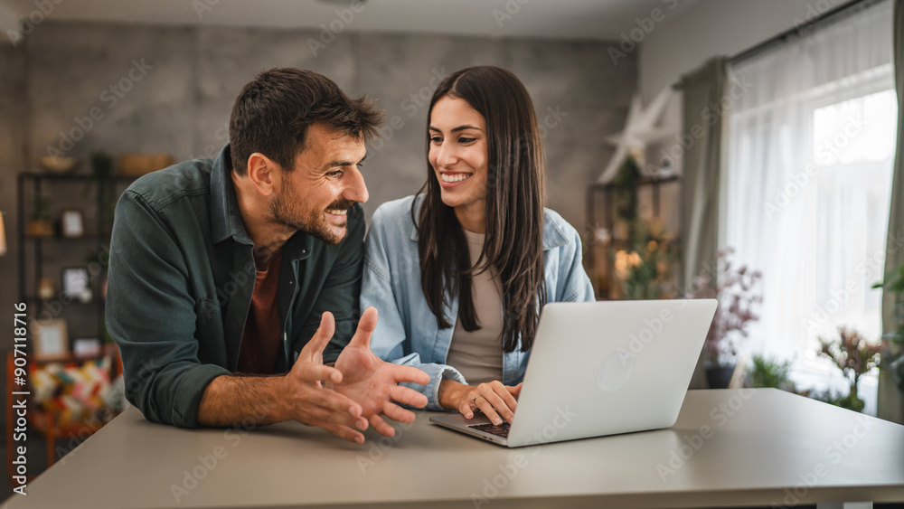 adult caucasian couple stand and use, study learn on laptop at home adult caucasian couple stand and use, study learn on laptop at home